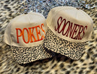 Two hats with 'POKES' and 'SOONERS' text on a leopard print background