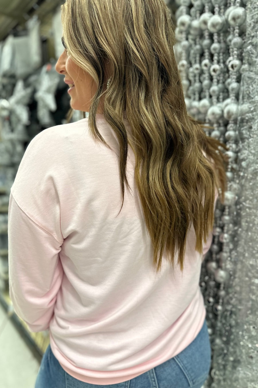 pink long sleeve top with shimmering silver rhinestones, sequins, & pearls champagne toasting glasses