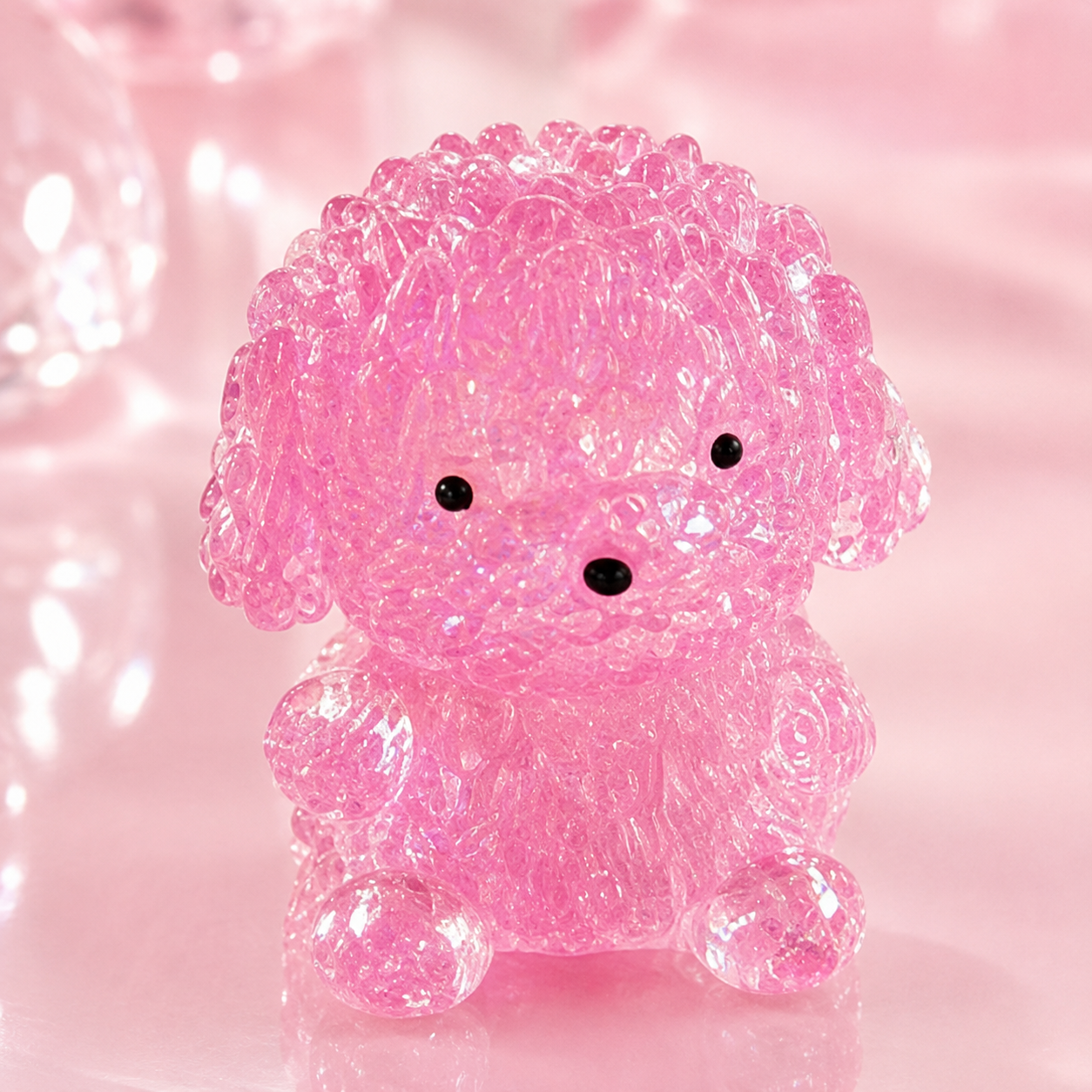 a pink gel-filled puppy-shaped squishy with a translucent crystal-like texture, assorted colors, tiny face details, and a soft handheld design