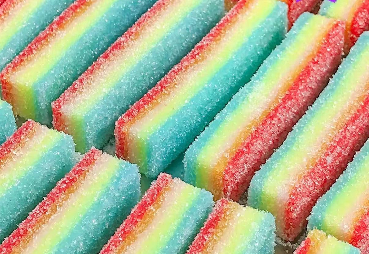 Close-up of colorful striped sour rainbow candy squishies