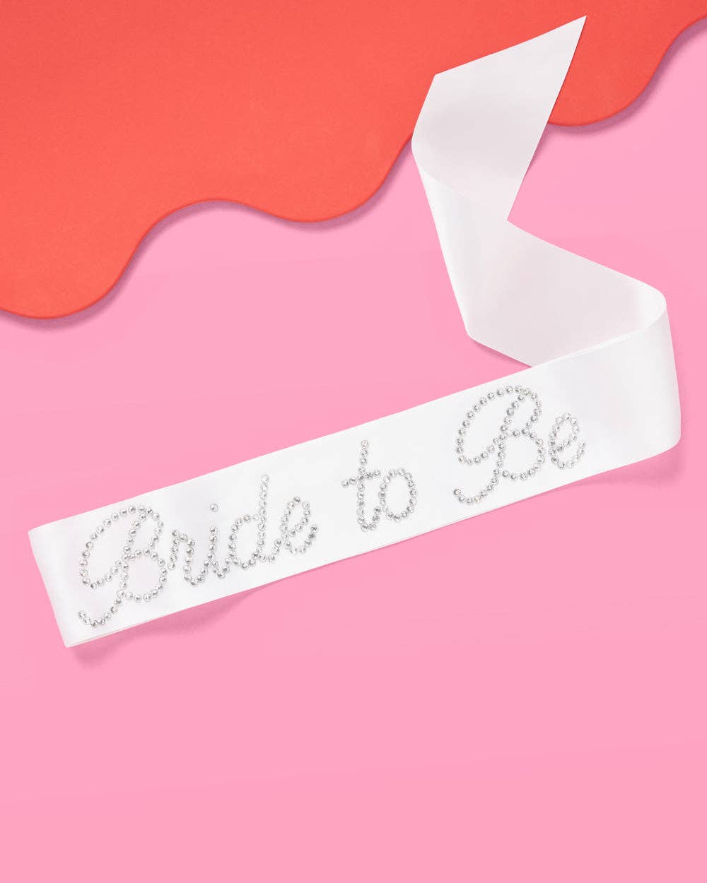 Sash with 'Bride to Be' text on a pink background
