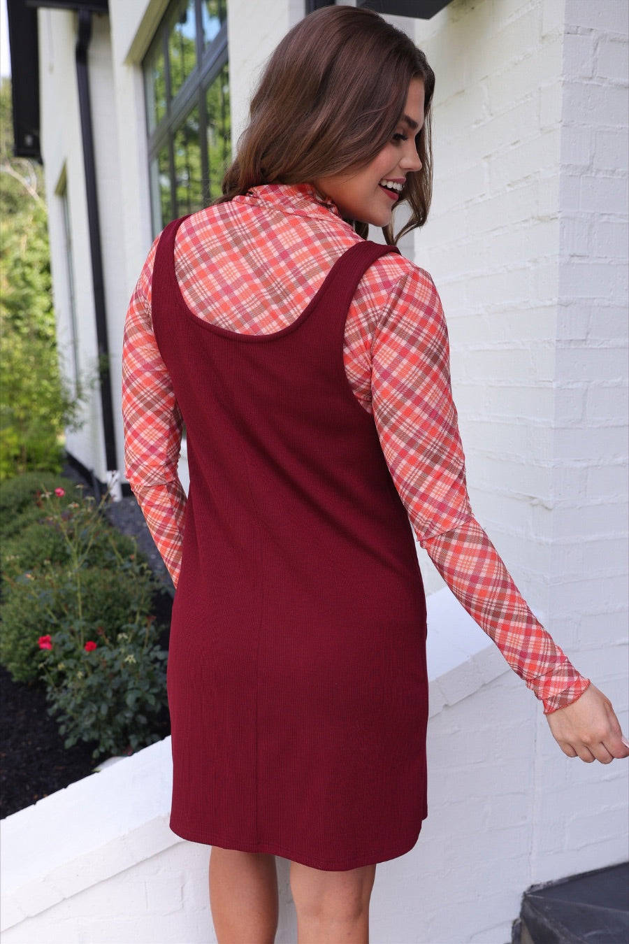 sleeveless ribbed dress with a scoop neckline, front patch pockets, and a relaxed silhouette in burgundy
