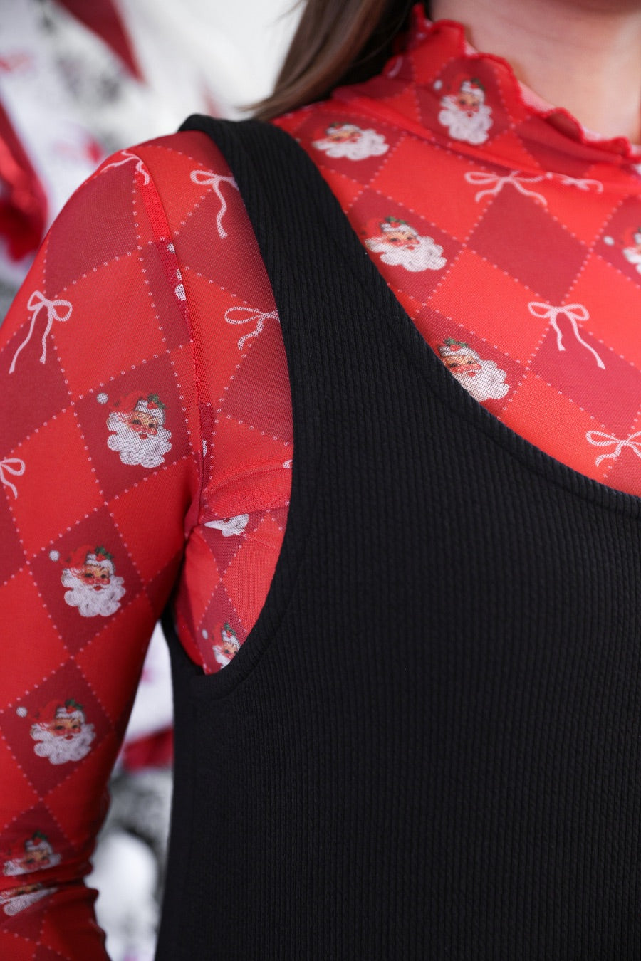 sleeveless ribbed dress with a scoop neckline, front patch pockets, and a relaxed silhouette in black