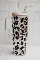 40-ounce black and brown animal print acrylic tumbler with a reusable straw (ivory), flexible mouthpiece (ivory), handle, screw-on lid (ivory with a grey rotate lid tab), and car cup holder compatible