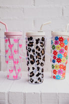 40-ounce pink bows, animal. print, and flowers pattern acrylic tumblers with a reusable clear straw, flexible mouthpiece, handle, screw-on lid, and car cup holder compatible