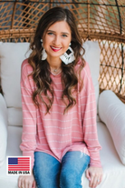 MADE IN USA lightweight horizontal striped top with long sleeves, a crew neckline, and a slouched silhouette that ends in a rounded hemline on a solid mauve base