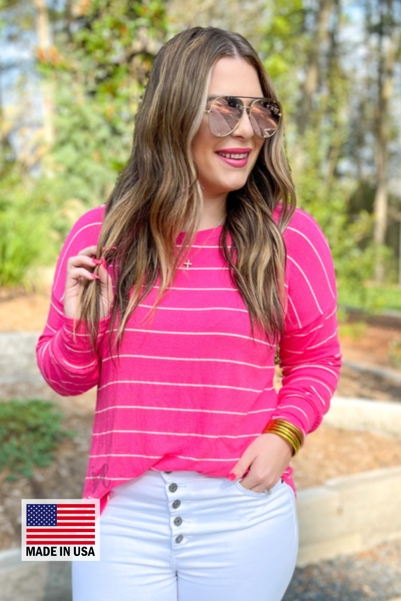 MADE IN USA lightweight horizontal striped top with long sleeves, a crew neckline, and a slouched silhouette that ends in a rounded hemline on a solid pink base