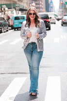 long sleeve blazer with all-over sequins, a collar, & an interior lining