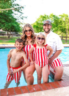 red and white striped swimsuit trunks for boys and men and one-piece for girls and women