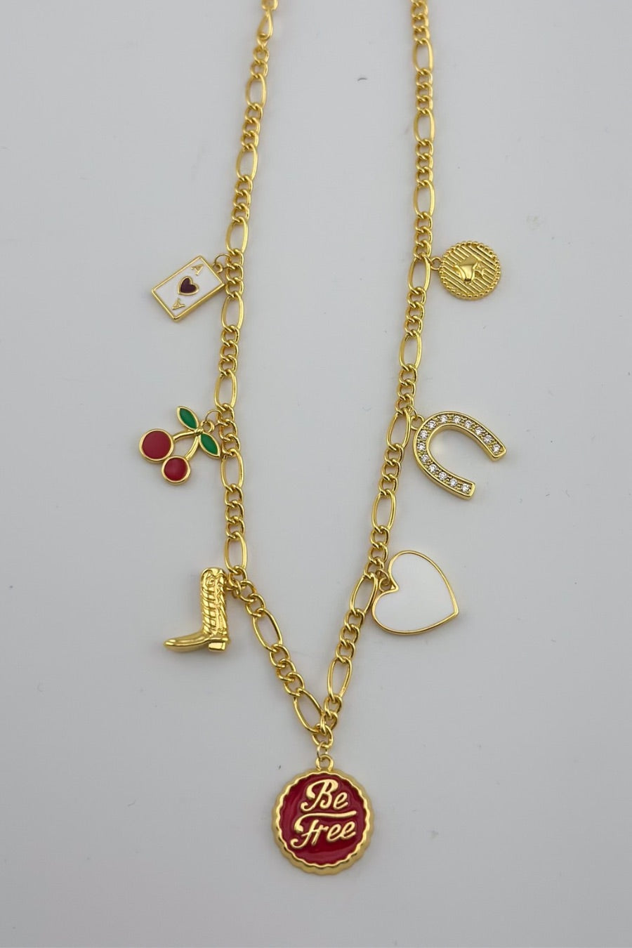 a gold-plated necklace with a stylish chain and seven charms 