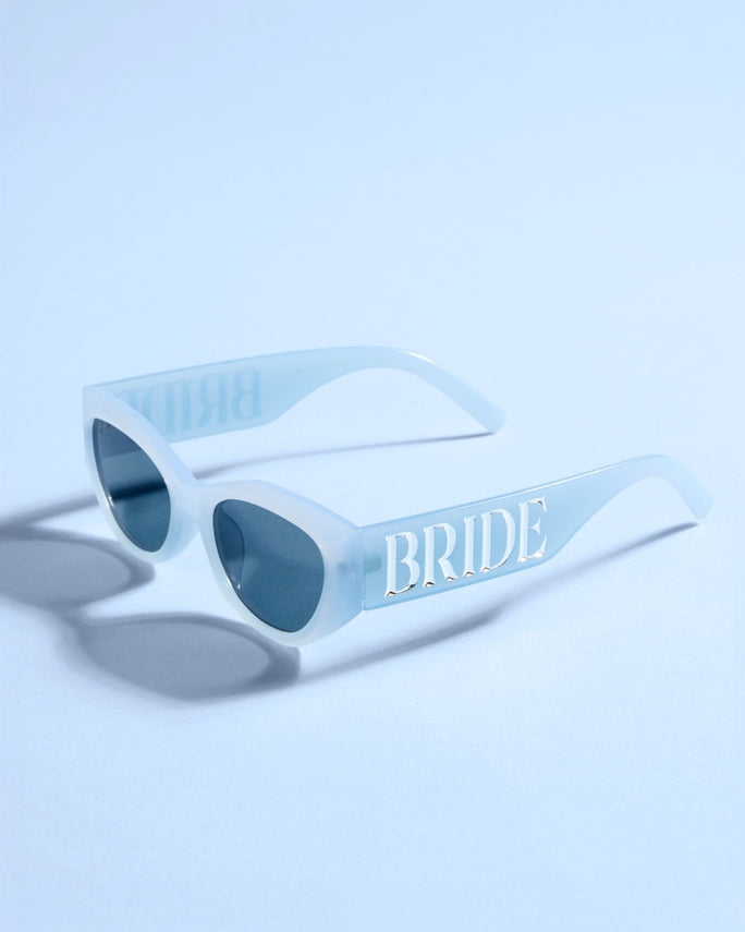 Sunglasses with 'BRIDE' text on a light blue background