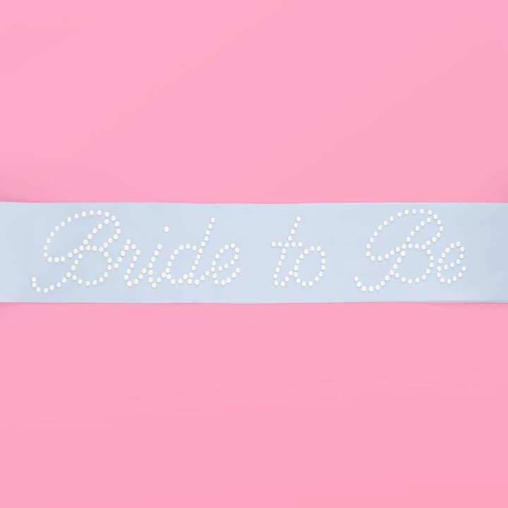 Sash with 'Bride to Be' text on a pink and light blue background