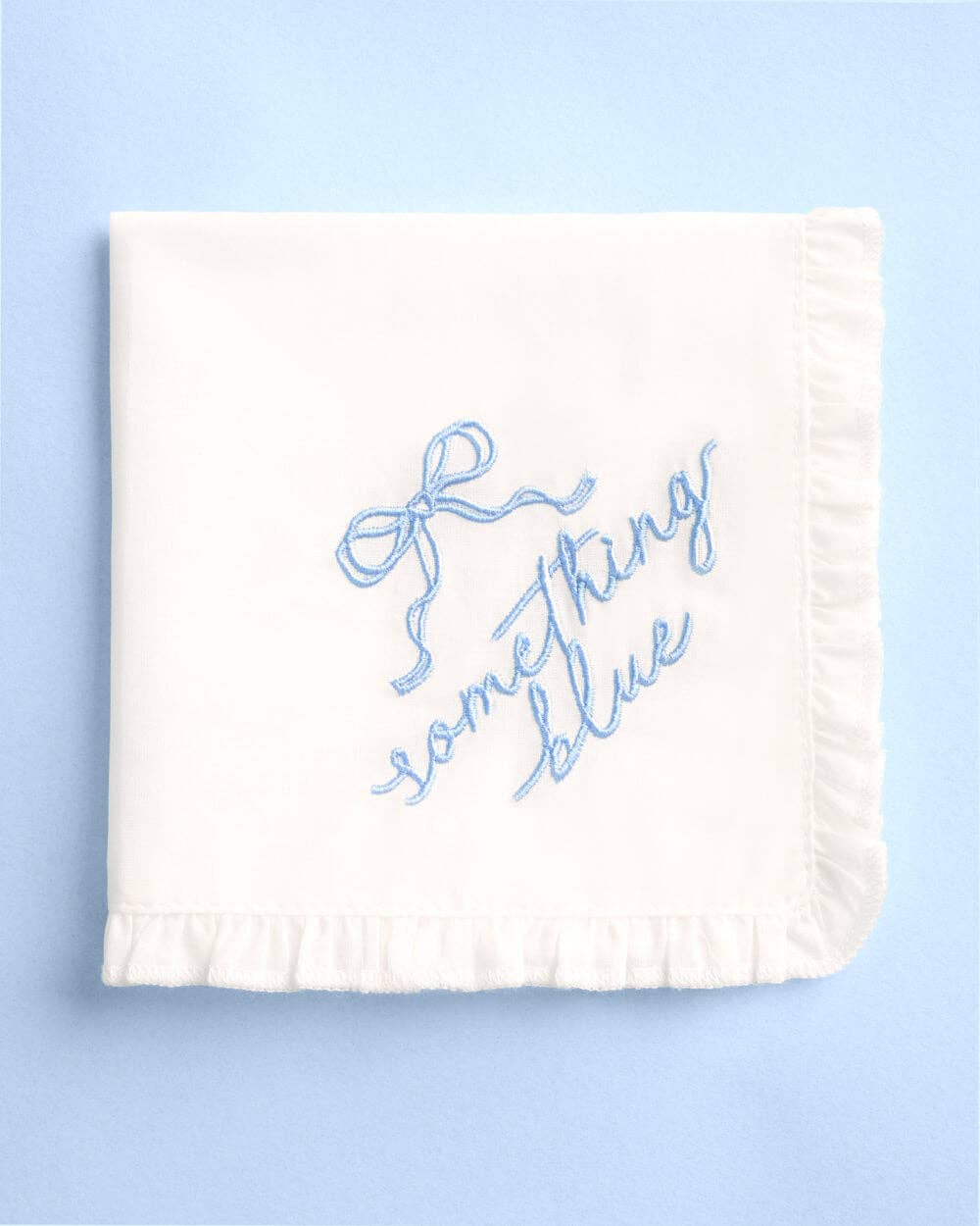 White towel with blue text on a light blue background