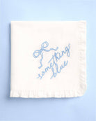 White towel with blue text on a light blue background