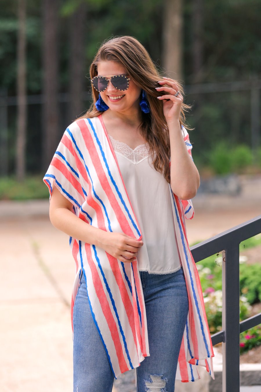 blue and orange vertical stripe pattern on an ivory fabric with an open front