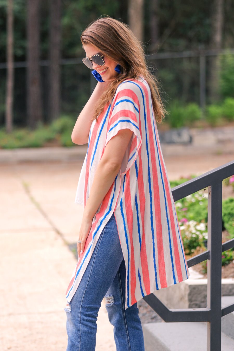 blue and orange vertical stripe pattern on an ivory fabric with an open front