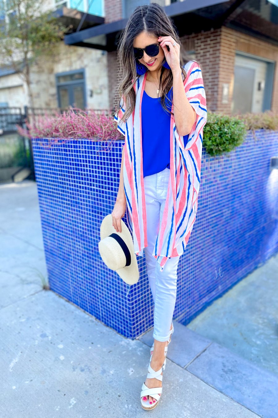 blue and orange vertical stripe pattern on an ivory fabric with an open front