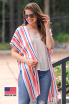 blue and orange vertical stripe pattern on an ivory fabric with an open front