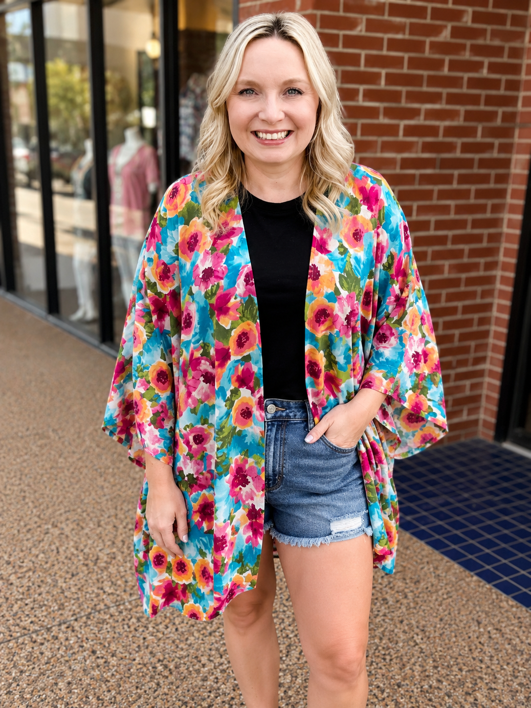 an exclusive, vibrant multicolor floral open-front kimono crafted from limited boutique fabric with lightweight woven material and a fluid, elongated drape