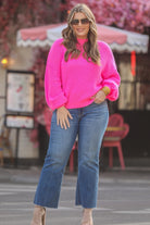 pink long sleeve sweater with a drop-shoulder for a relaxed fit, a crew neckline, and a ribbed hemline on a textured ultra-soft design fabric