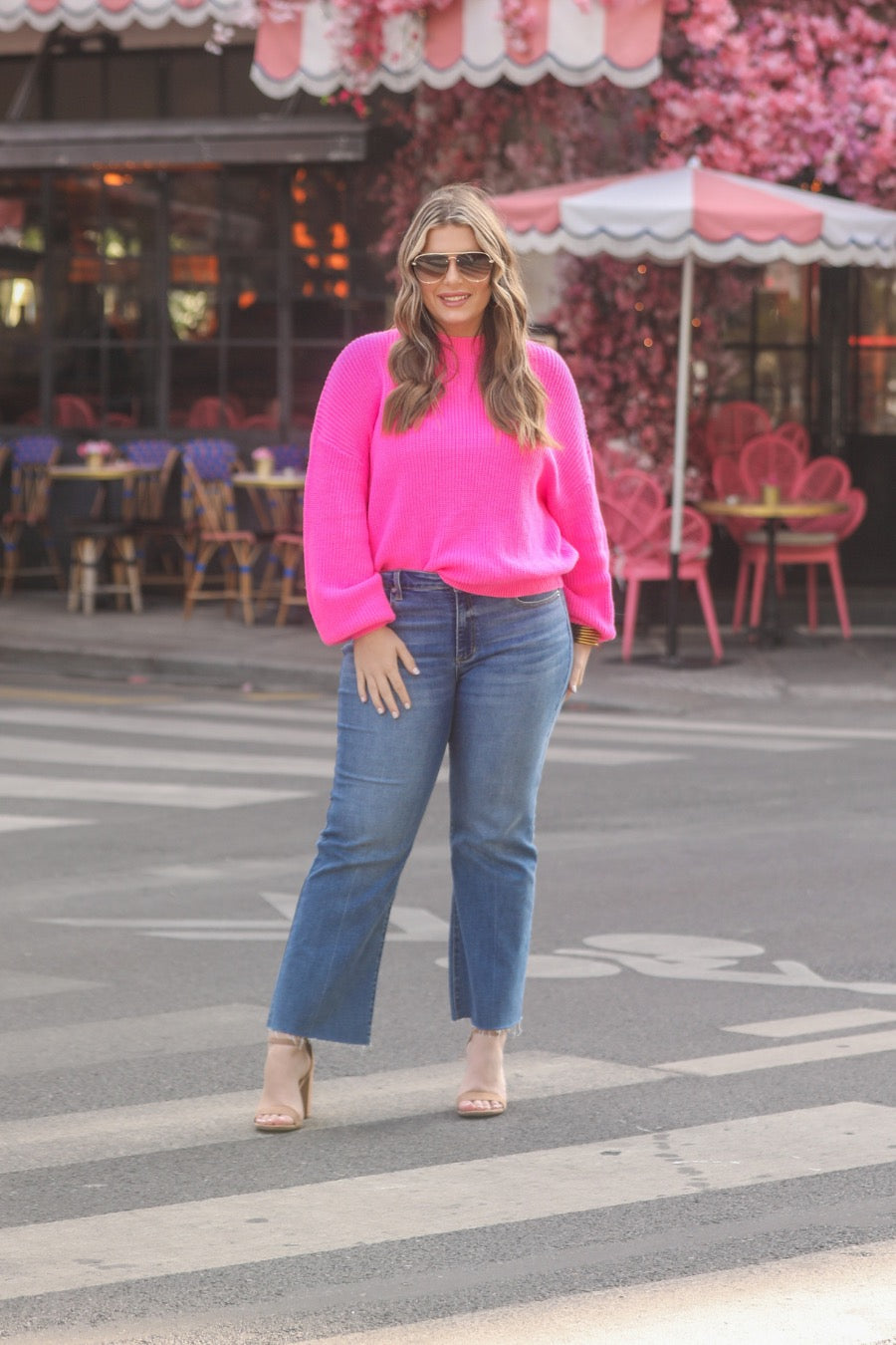 pink long sleeve sweater with a drop-shoulder for a relaxed fit, a crew neckline, and a ribbed hemline on a textured ultra-soft design fabric