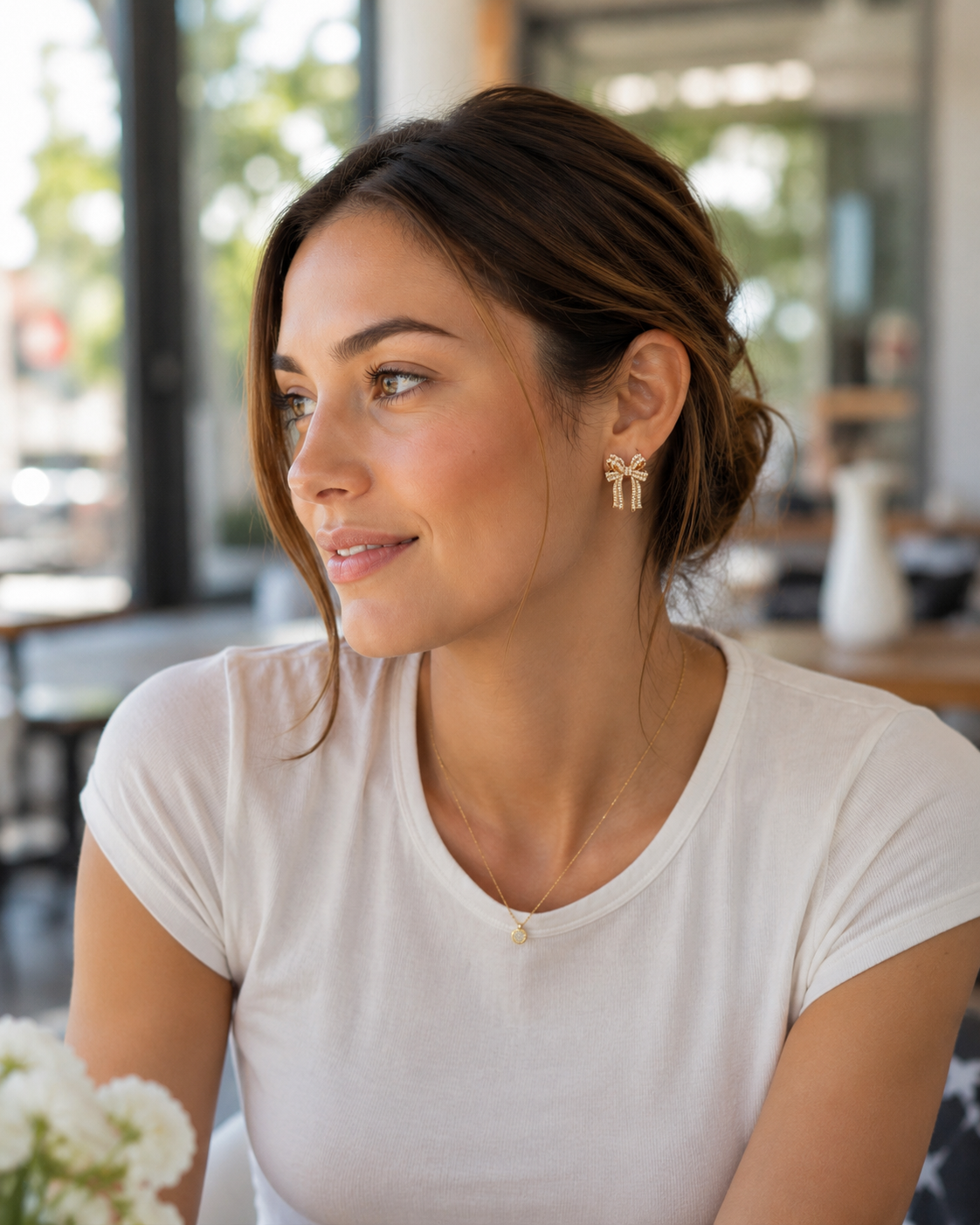 high-quality gold bow post-stud earrings with pearl embellishments, rhinestone accents, a structured silhouette, and gold comfort earring backs