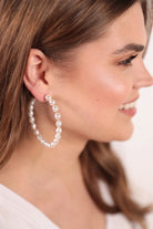 post-stud pearl hoops with a comfort earring back in gold