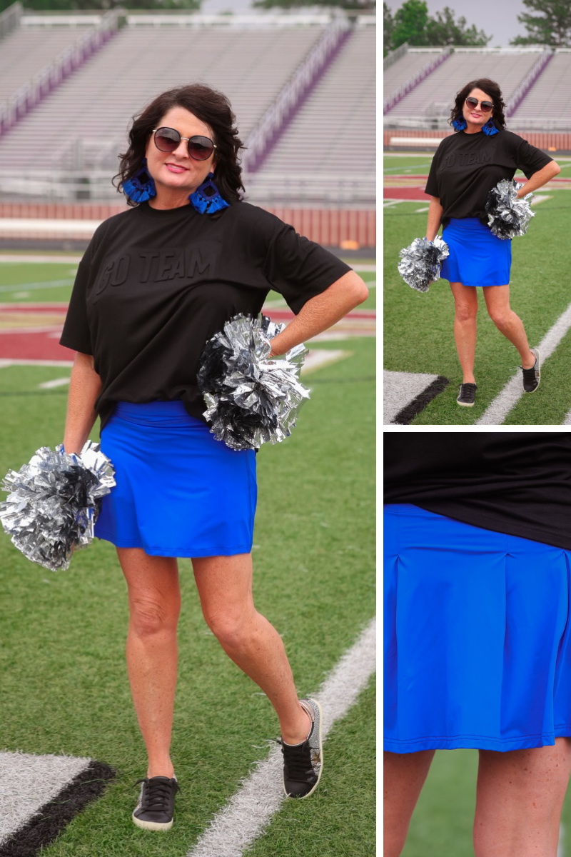 a royal blue true-to-size tennis skort designed with a slimming fit, built-in shorts, interior side pockets, smooth stretch fabric, pleated back, high rise waistband, and mini length