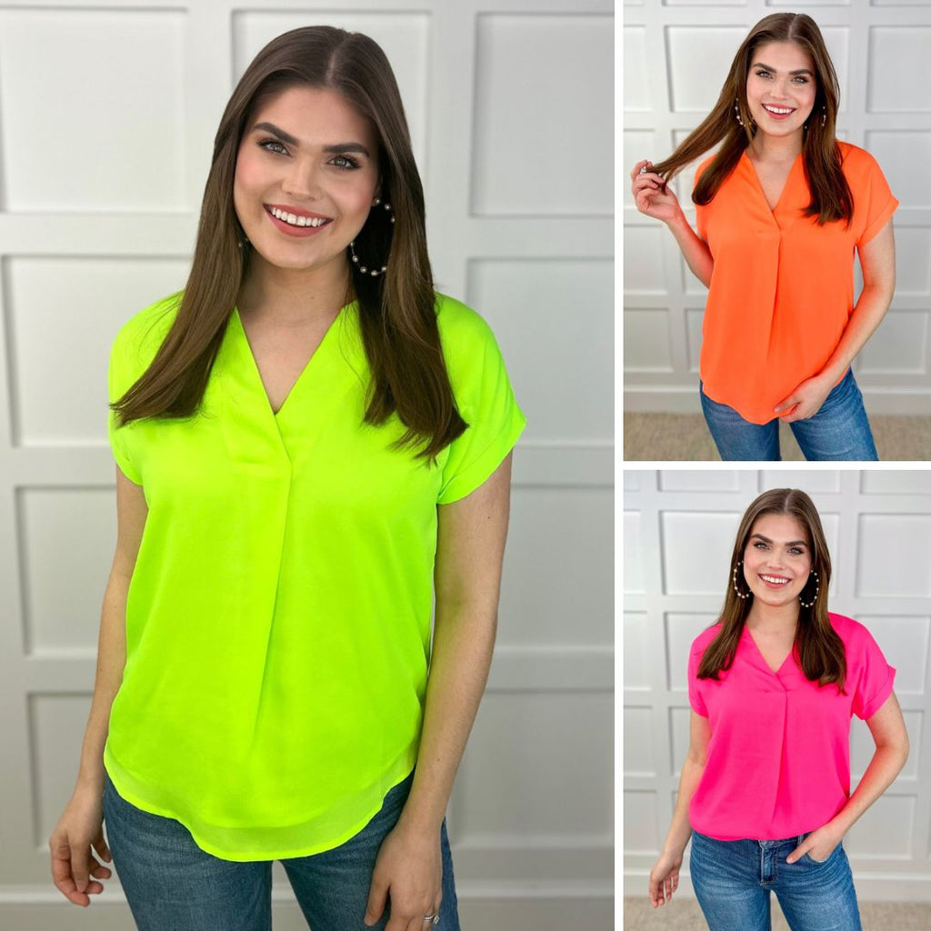 lightweight, soft woven fabric in vibrant neon colors that drapes luxuriously over the body with a modern v-neckline & cuffed short sleeves