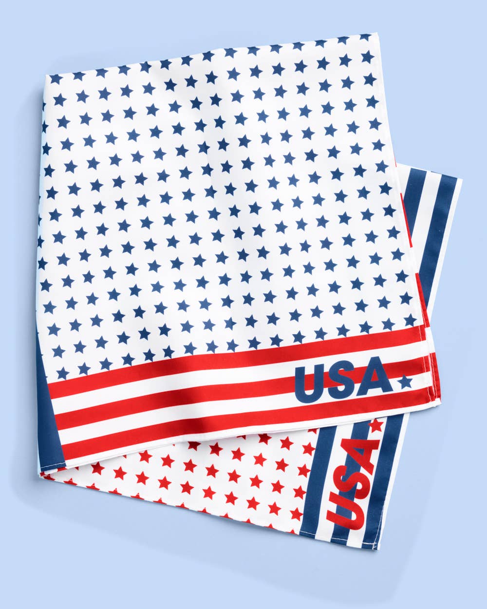 a soft lightweight square polyester bandana with a red, white, and blue flag-inspired print, stars, strips, Team USA lettering, and versatile styling options