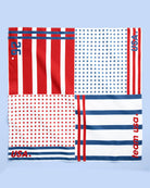 a soft lightweight square polyester bandana with a red, white, and blue flag-inspired print, stars, strips, Team USA lettering, and versatile styling options