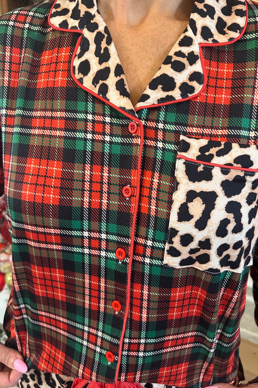 long sleeve top and matching shorts on a plaid base with a mix of leopard print and red accents