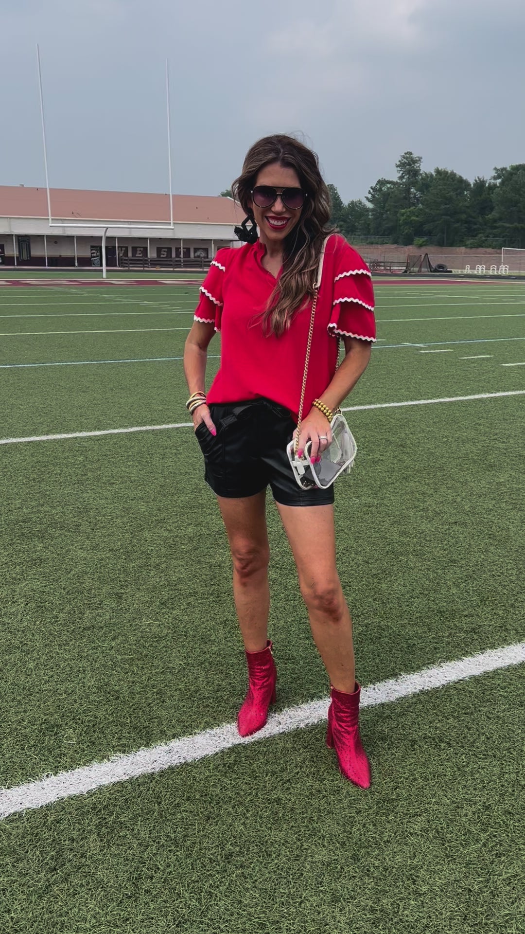 a playful V-neckline top with a ric rac trim detailing on the layered ruffled short sleeves