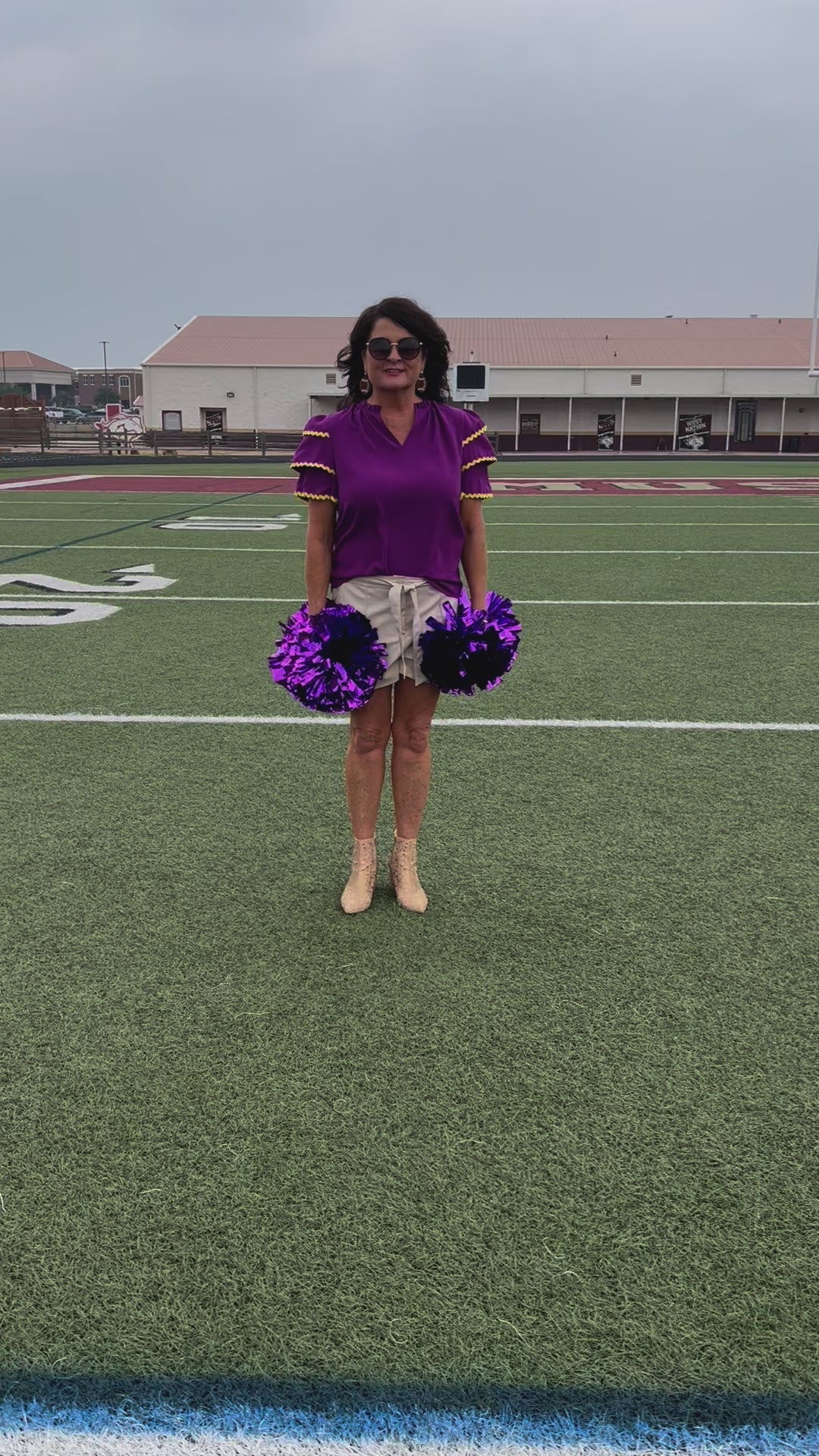 a playful V-neckline top with a ric rac trim detailing on the layered ruffled short sleeves