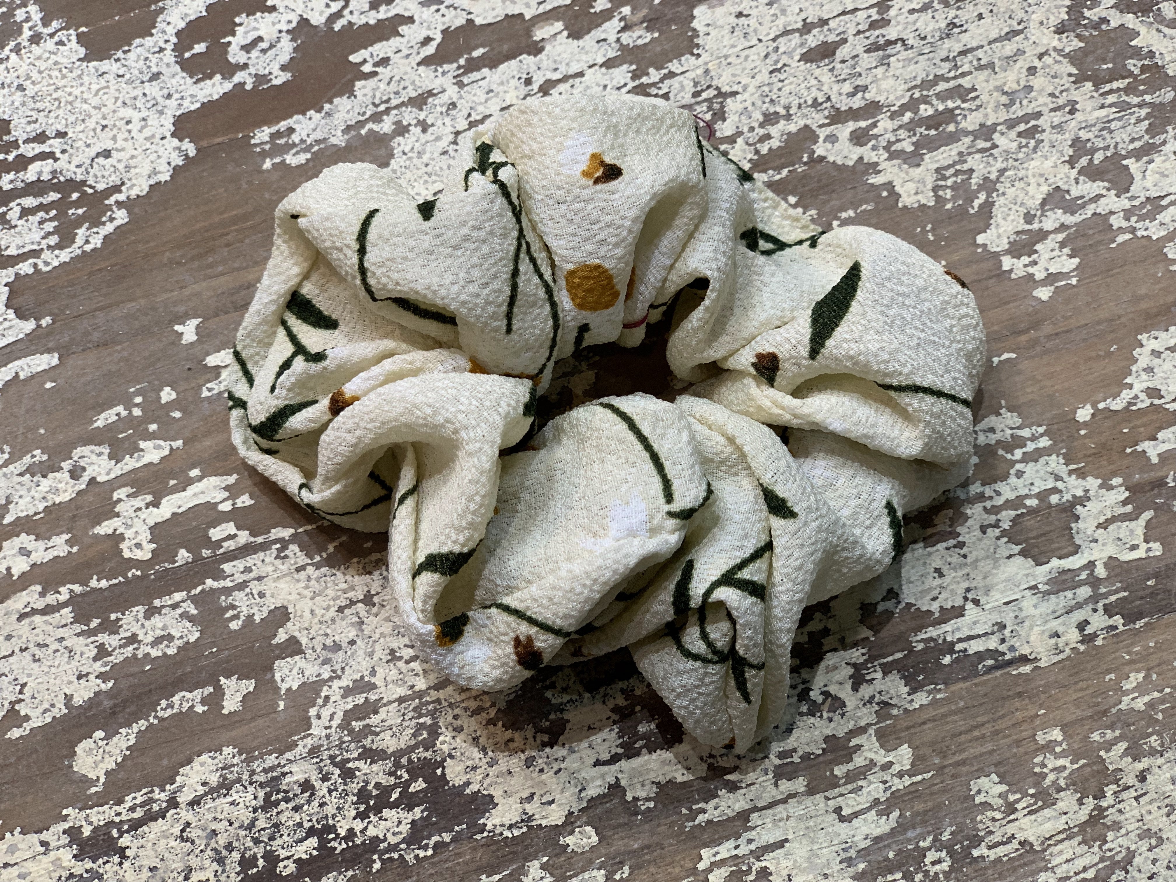an oversized floral scrunchie with lightweight textured fabric, gathered construction, gentle hair-friendly hold, and easy pull-on styling in banana