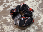 an oversized floral scrunchie with lightweight textured fabric, gathered construction, gentle hair-friendly hold, and easy pull-on styling in black