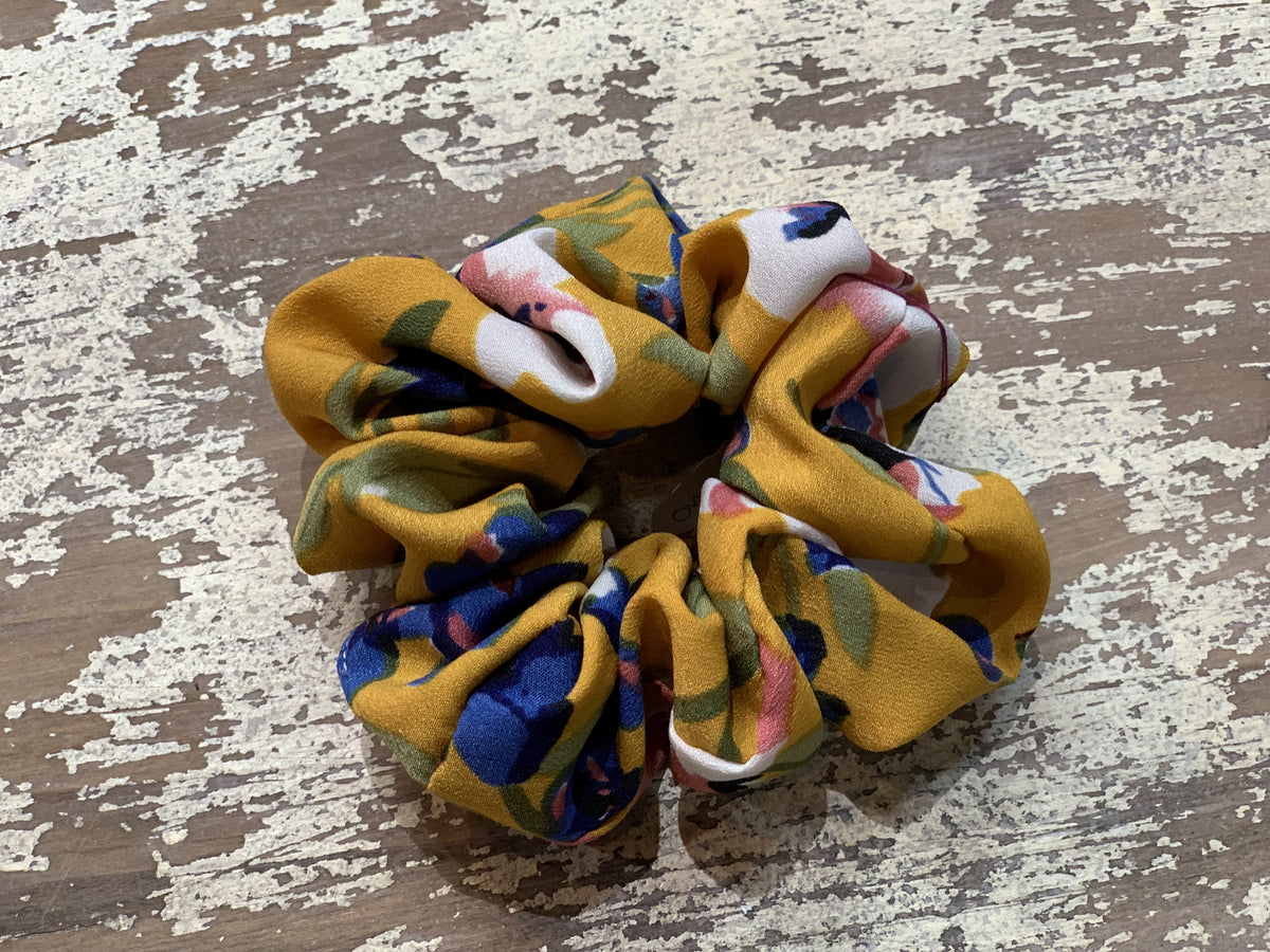 an oversized floral scrunchie with lightweight textured fabric, gathered construction, gentle hair-friendly hold, and easy pull-on styling in butterscotch