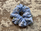 an oversized floral scrunchie with lightweight textured fabric, gathered construction, gentle hair-friendly hold, and easy pull-on styling in sky