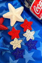 Americana-inspired beaded star earrings with red, white, and blue details, felt backing, and a push-back closure