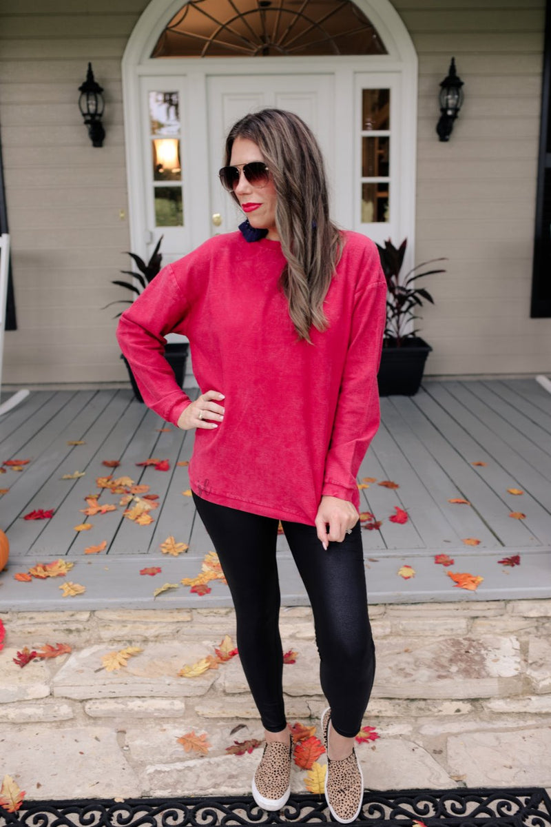 a long-sleeve ribbed textured pullover with a crew neck collar, a vintage wash, and a relaxed fit in red