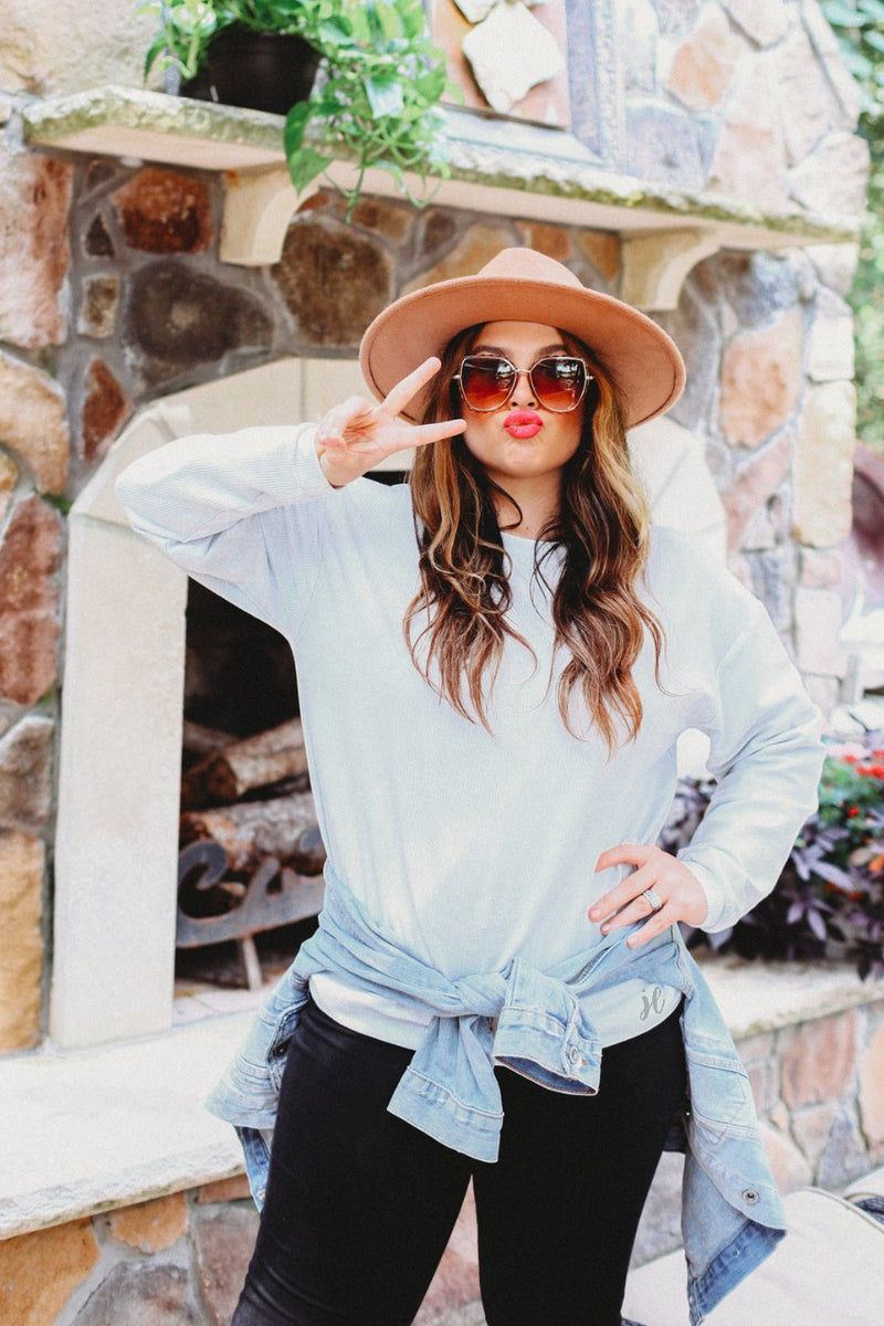 a long-sleeve ribbed textured pullover with a crew neck collar, a vintage wash, and a relaxed fit in silver