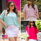 a lightweight short-sleeve woven tunic with a V-neckline, a front chest pocket, and a relaxed, non-stretch silhouette in aqua, lilac, and magenta, accented with a MADE IN USA watermark in the bottom left-hand corner