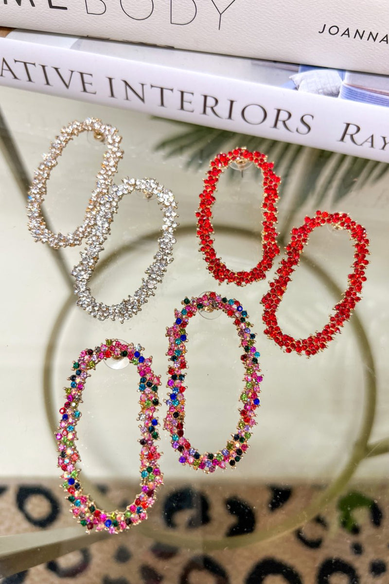 gold cubic zirconia earrings secured with a push backing in a long oval shape in crystal, multi, and red