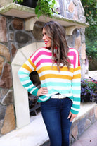 long sleeve sweater made of soft knitted material with colorful stripes