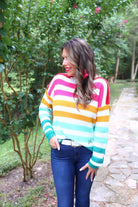 long sleeve sweater made of soft knitted material with colorful stripes