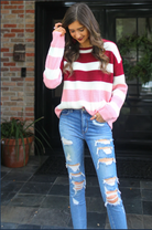 long sleeve sweater made of soft knitted material with colorful stripes in shades of pink in reverse ombré