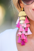 stud earrings with multi-layers of tassels in bold colors, gold bullet earring backs, and clear rubber stoppers in pink multi