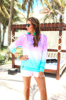 a relaxed fit, a trendy color gradient ombre design, and ribbed neckline, cuffs, and hem