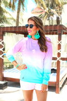 a relaxed fit, a trendy color gradient ombre design, and ribbed neckline, cuffs, and hem