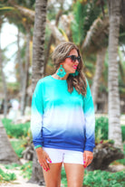 a relaxed fit, a trendy color gradient ombre design, and ribbed neckline, cuffs, and hem